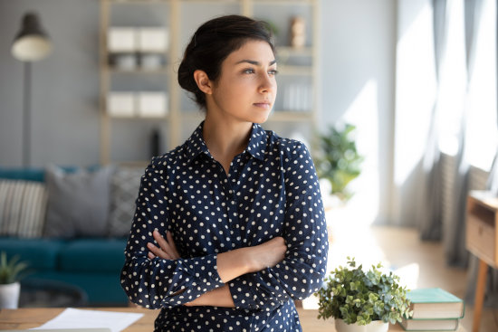 Young woman discussing pregnancy problems with counsellor